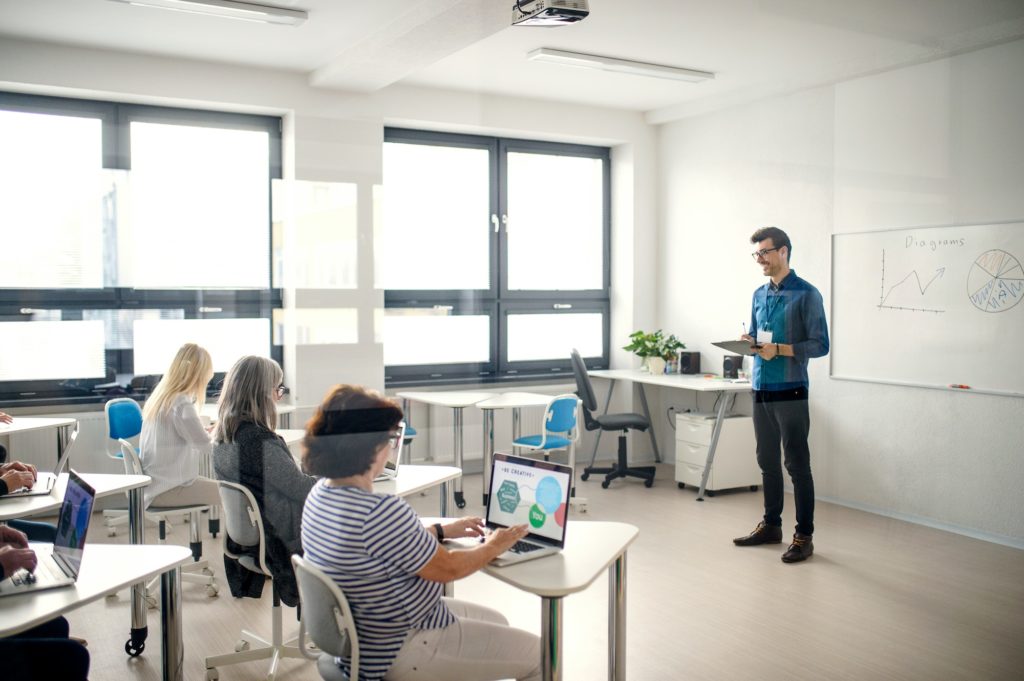 Group of senior people attending computer and technology education class