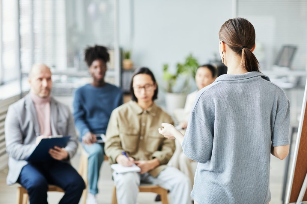 Young Woman Speaking to Audience